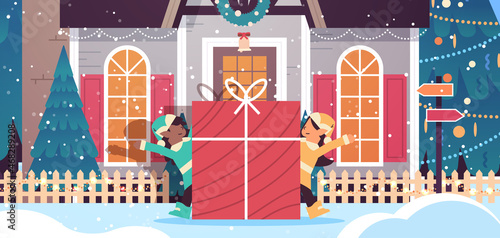 elves preparing for new year and christmas holidays celebration mix race santa helpers holding gift box