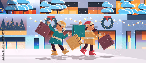 elves with purchases preparing for new year and christmas holidays celebration santa helpers holding shopping boxes
