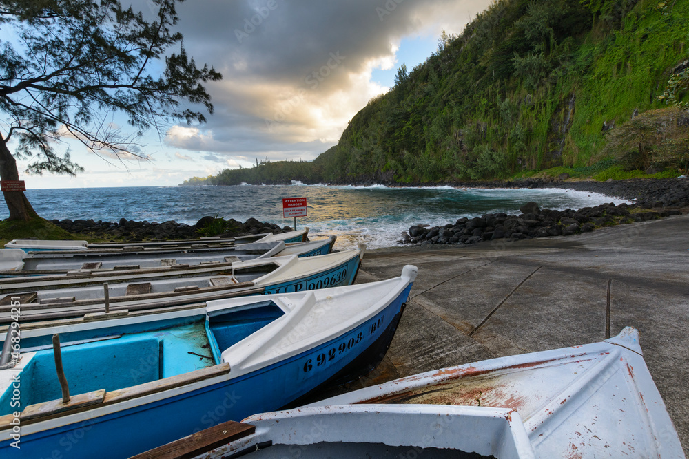 Boats and coast at Anse des Cascades near Sainte Rose city, Reunion Island