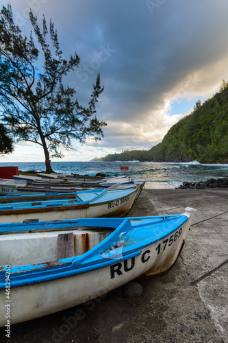 Boats and coast at Anse des Cascades near Sainte Rose city  Reunion Island