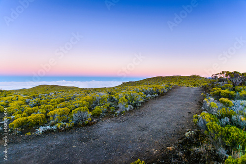 Hiking trail during sunrise at volcanic area of Reunion Island