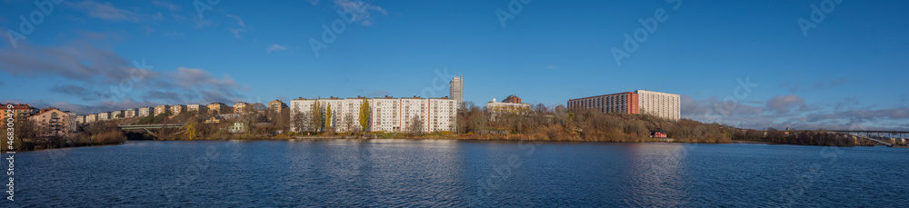 Apartment houses at the waterfront of the Stockholm islands Lilla Essingen and Kungsholmen a sunny and color full autumn day in Stockholm