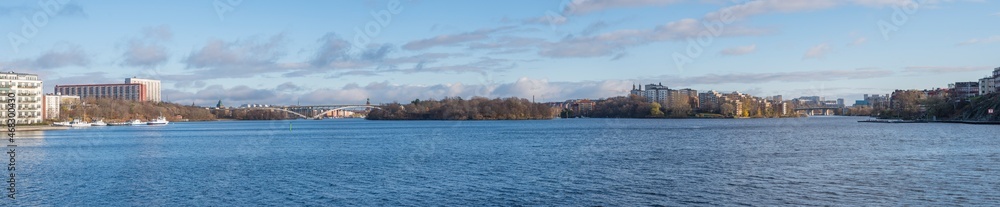 Panorama view over the lake Mälaren with the districts Kungsholmen, Södermalm, Gröndal and the previous prison island Långholmen a sunny and color full autumn day in Stockholm