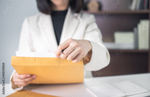 Business woman in suite working with documentary data on white desk at office, Business accounting and financial concept