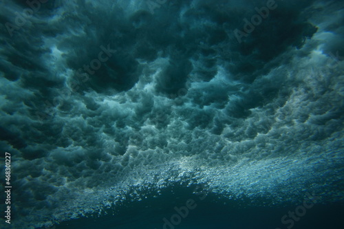 wave breaking viewed from underwater