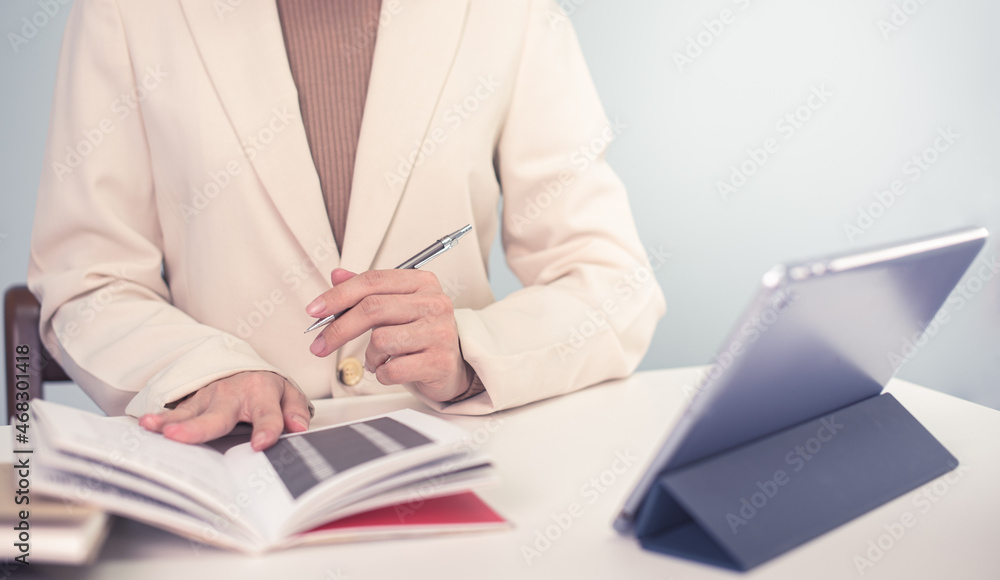 Business woman in suite working with documentary data on white desk at office, Business accounting and financial concept Business woman in suite working with documentary data on white desk at office, Business accounting and financial concept
