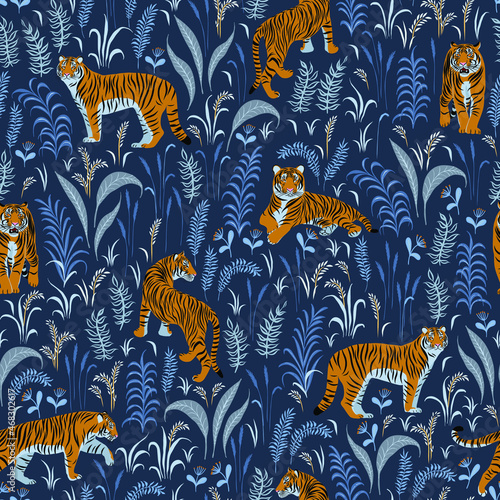 Tigers and plants. Seamless pattern on a blue background.