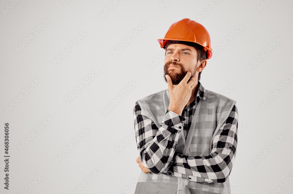 working man in orange hard hat construction professional Studio