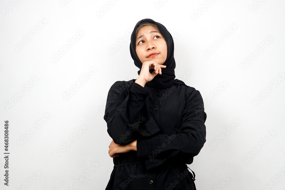 Beautiful asian young muslim woman thinking, looking for ideas, looking for solutions to problems, with hands holding chin, isolated on white background Beautiful asian young muslim woman thinking, looking for ideas, looking for solutions to problems, with hands holding chin, isolated on white background