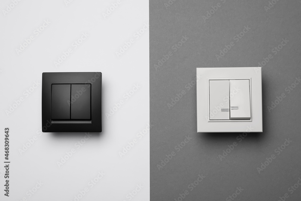 White and black light switches on color background White and black light switches on color background