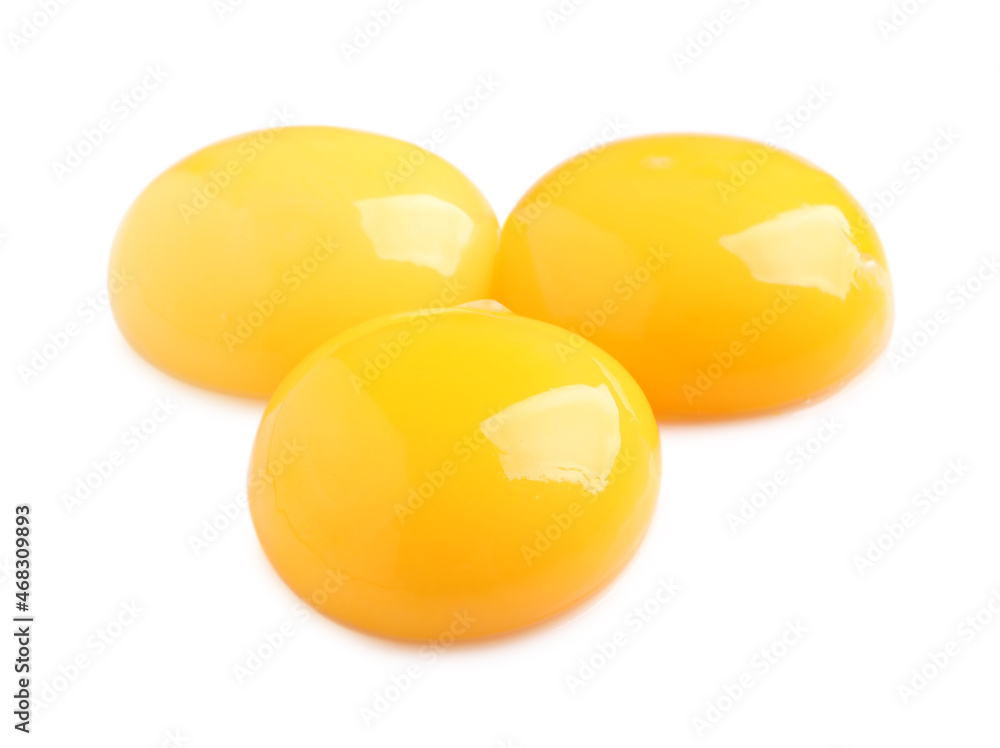 Raw chicken egg yolks on white background Raw chicken egg yolks on white background