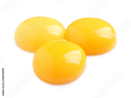 Raw chicken egg yolks on white background