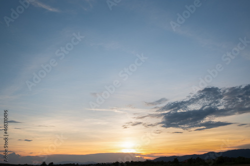 Colorful sunset and sunrise with clouds. Blue and orange color of nature. Many white clouds in the blue sky. The weather is clear today. sunset in the clouds. The sky is twilight. © gexphos