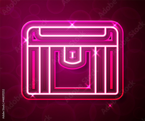 Glowing neon line Antique treasure chest icon isolated on red background. Vintage wooden chest with golden coin. Vector