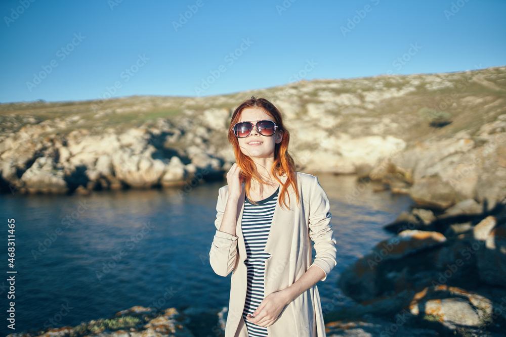 woman outdoors rocks ocean travel summer