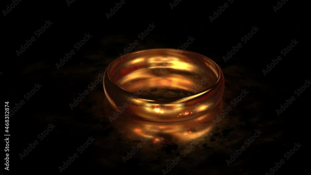 Flying around the gold ring MARRY ME on the matte glass surface with reflection Flying around the gold ring MARRY ME on the matte glass surface with reflection