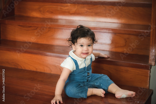 little toddler children with first walk step with stairs at home, small baby person are happy to play and learn to crawling with family, cute infant boy having fun and childhood care