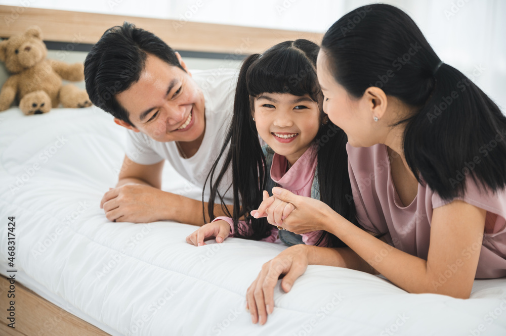 happy love family lifestyle with Asian father and mother and child daughter at home together happy love family lifestyle with Asian father and mother and child daughter at home together