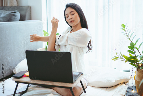 young Asian woman freelance working business work on laptop at home, working from home concept © chokniti