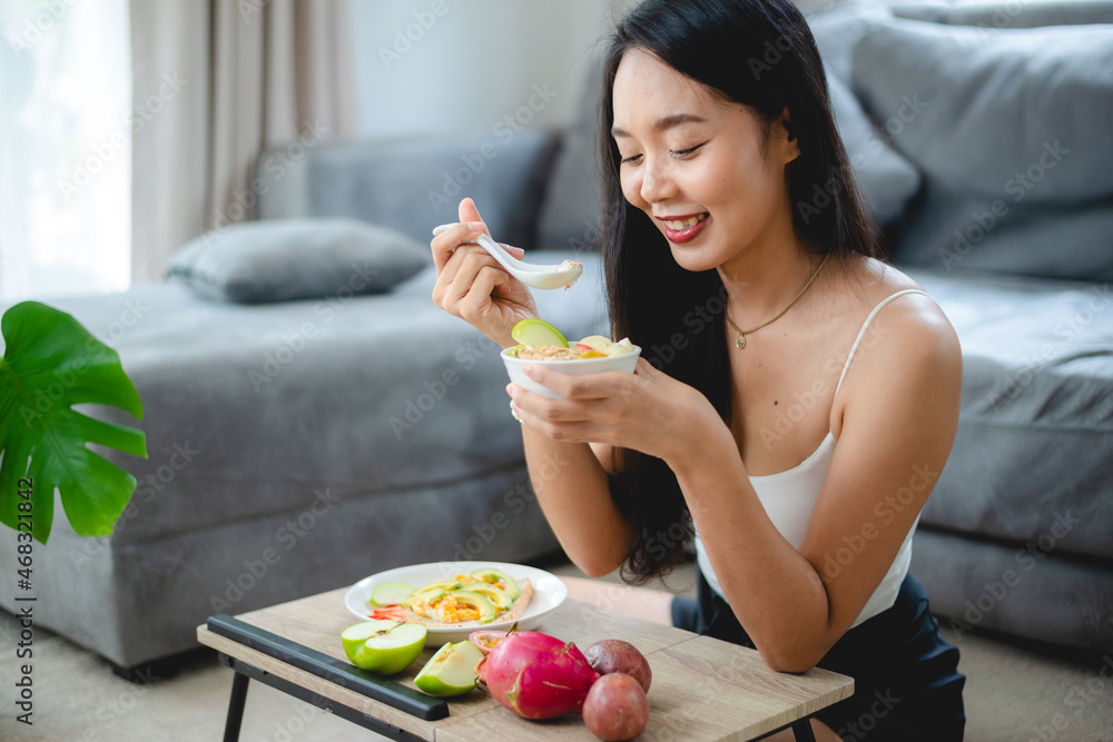 young Asian woman girl holding health food fresh vegetable in lifestyle at home, female beautiful vegetarian person doing diet nourishment eat salad meal, people are smile happy, healthy food concept