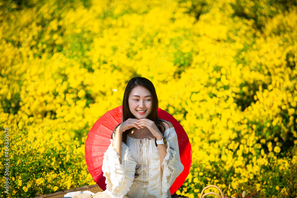 Beautiful asian girl Taking pictures in a flower farm. Happily in Chiang Mai, Thailand