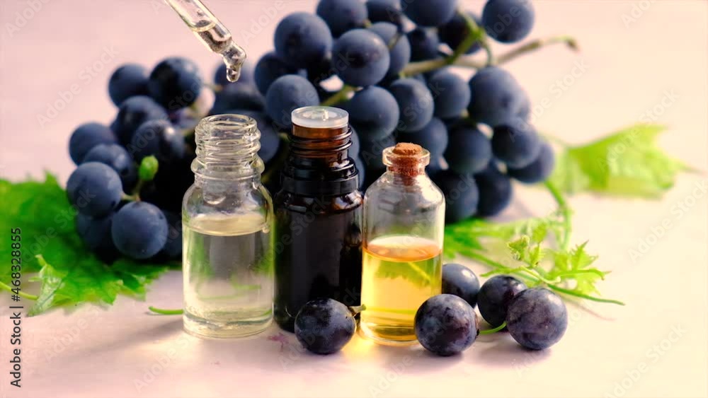 Bottle of grape seed oil. Selective focus. Bottle of grape seed oil. Selective focus.