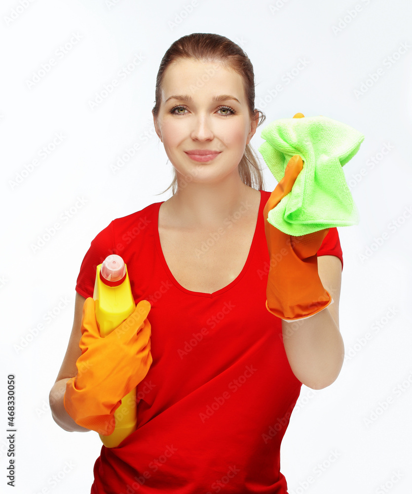 young girl holding detergents and starts cleaning young girl holding detergents and starts cleaning