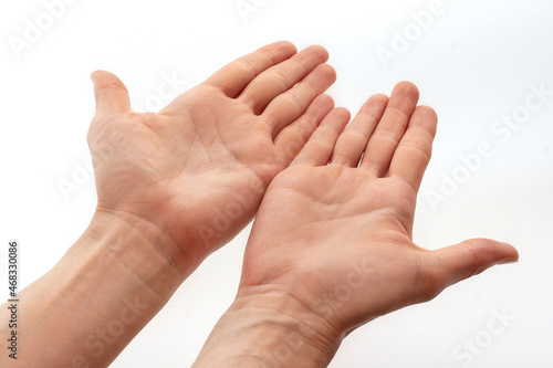 Two open empty men's hands isolated on white background. Top view