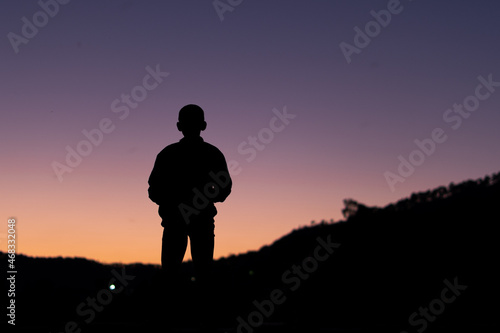 silhouette of a young boy during sunset © Anuj