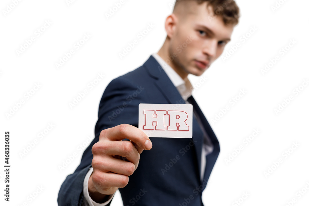 A businessman shows an inscription: HR A businessman shows an inscription: HR