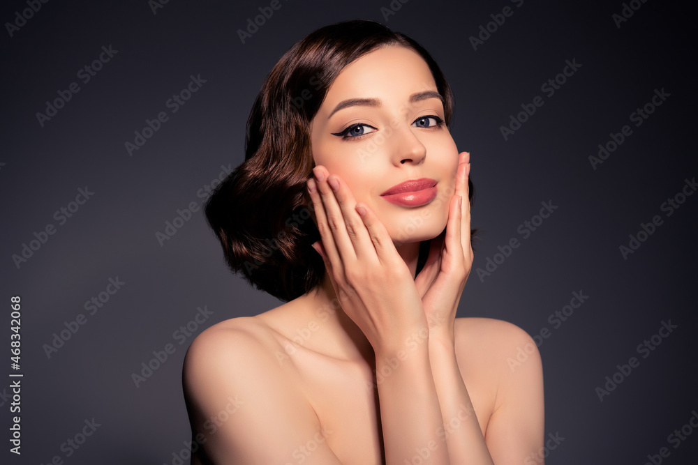 Photo of smiling beautiful good looking female touch cheeks apply moisturizing cream isolated on black color background Photo of smiling beautiful good looking female touch cheeks apply moisturizing cream isolated on black color background