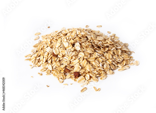 Oat flakes uncooked in white bowl on white background concept