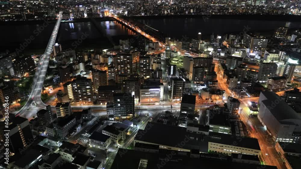 Aerial view time lapse of Osaka City central business downtown and Yodo ...