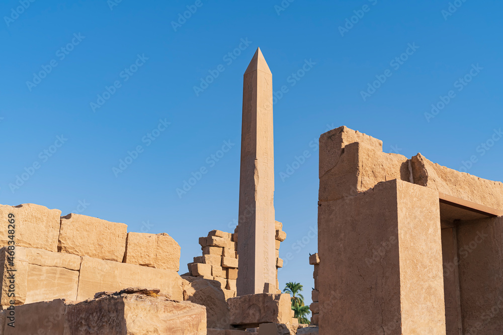 Photo of an obelisk among the ruins of the Karnak Temple. Photograph taken in Karnak, Luxor, Egypt. 
