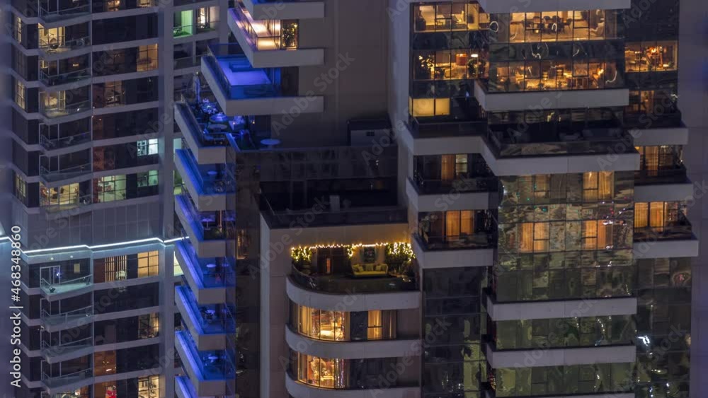 Light in windows of modern towers. Exterior of apartment building at night with glowing windows timelapse. Light in windows of modern towers. Exterior of apartment building at night with glowing windows timelapse.
