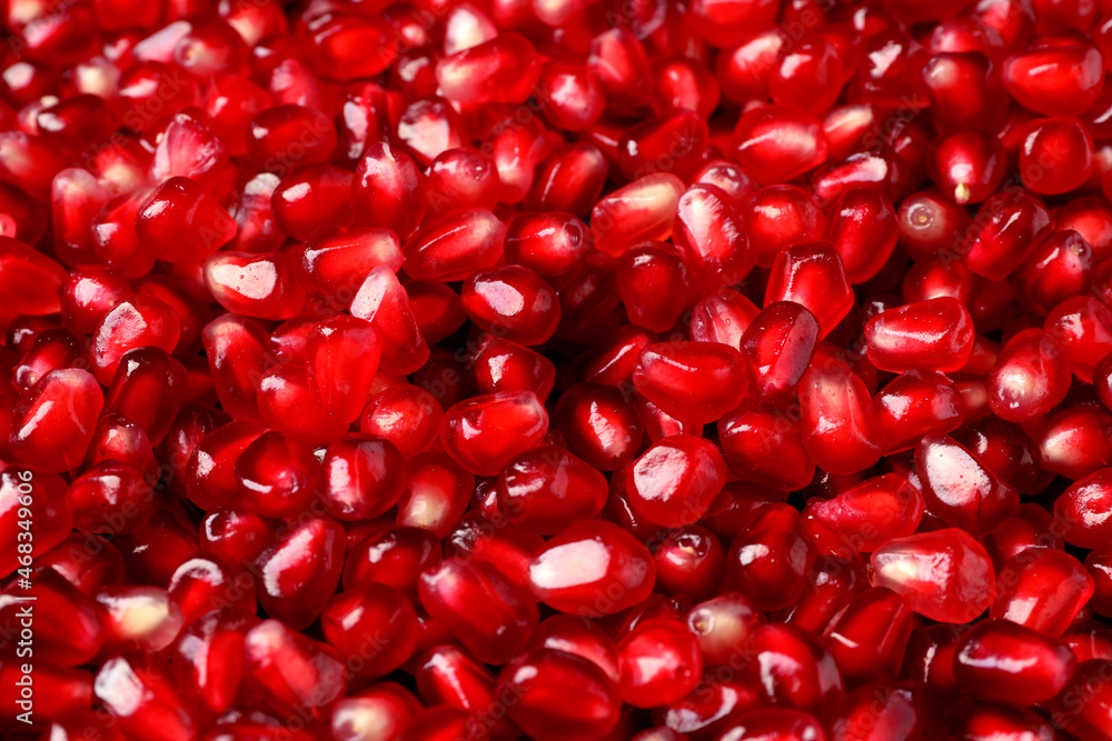 Many tasty pomegranate seeds as background, closeup
