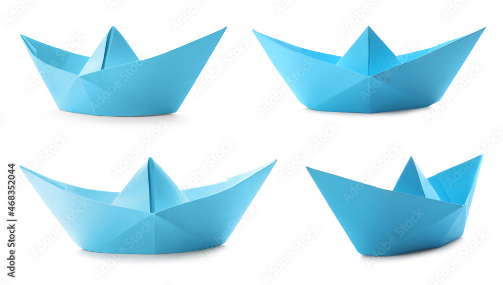 Set with light blue paper boats on white background Set with light blue paper boats on white background