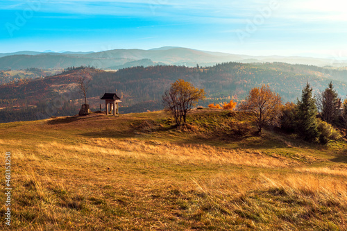 Beautiful view on polish mountains Beskidy seen from Ochodzita Mountain in the autumn, evening light. photo