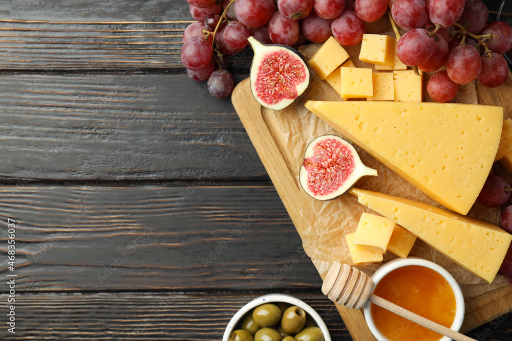 Concept of cooking eating with hard cheese on wooden background Concept of cooking eating with hard cheese on wooden background