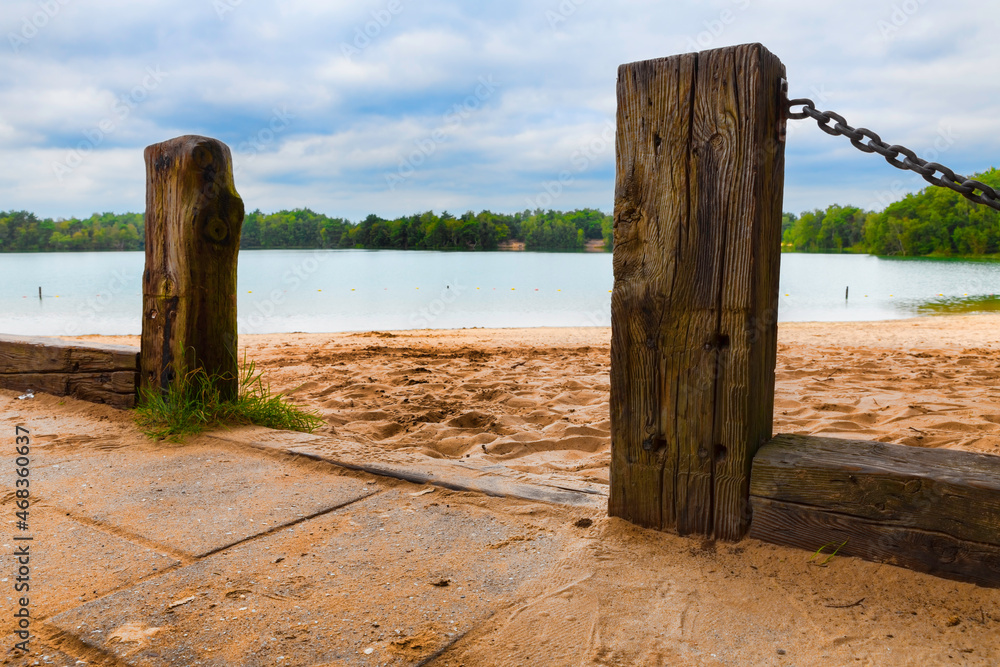 wooden poles at a lake in holland wooden poles at a lake in holland