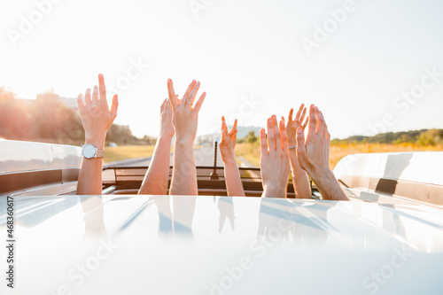 Принти на полотні stick out hands from car sunroof happy road trip