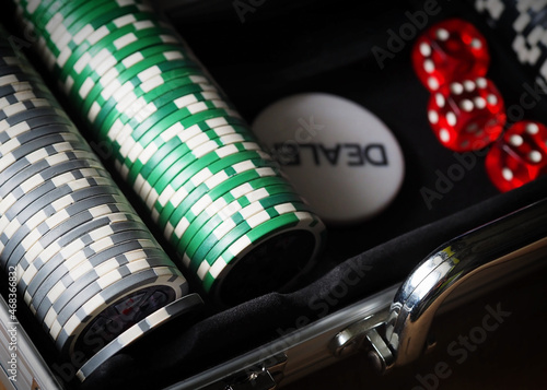 red playing dice, poker plastic chips, close-up, macrophotography, selective focus, blurry background, risk concept, stock exchange game, casino, gambling, gambling, excitement
