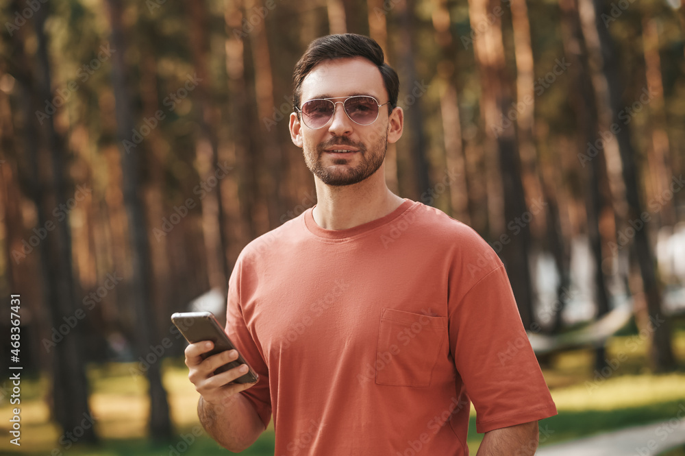 Man in sunglasses standing in nature Man in sunglasses standing in nature