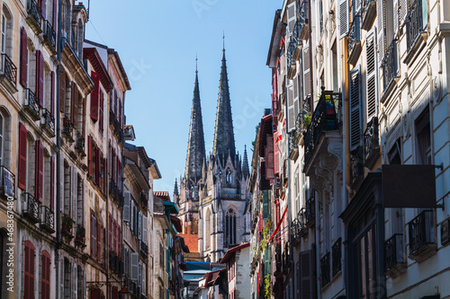Street of a city in France with the cathedral towers in the background © Dani Palazón