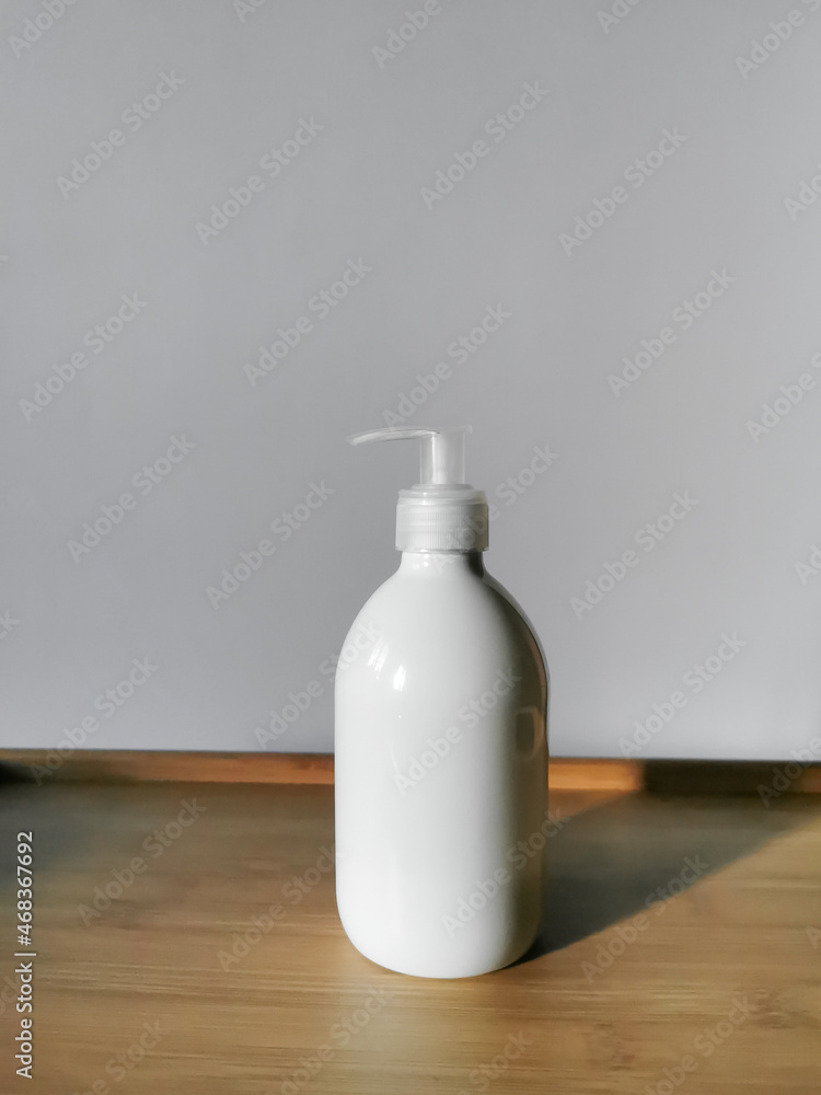 Body lotion in white dispenser bottle. For daily body care. Body lotion in white dispenser bottle. For daily body care.