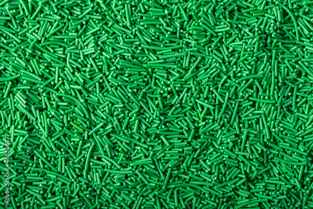 Green topper sprinkles closeup, top view Green topper sprinkles closeup, top view