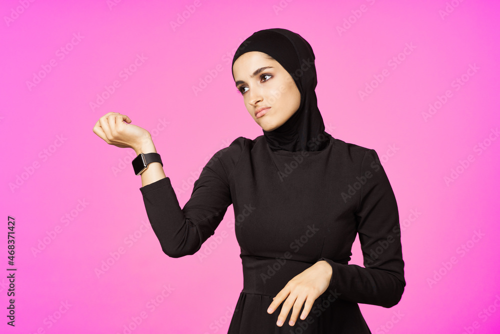 muslim woman with smart watch technology gadget pink background muslim woman with smart watch technology gadget pink background