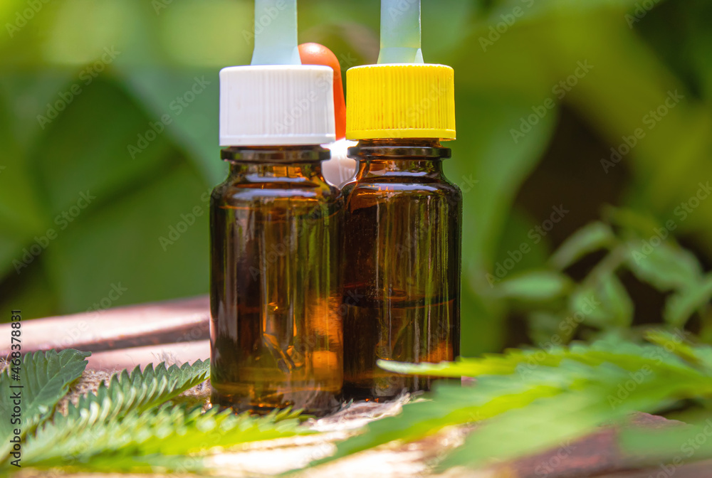 cannabis oil in a small jar. Selective focus. cannabis oil in a small jar. Selective focus.
