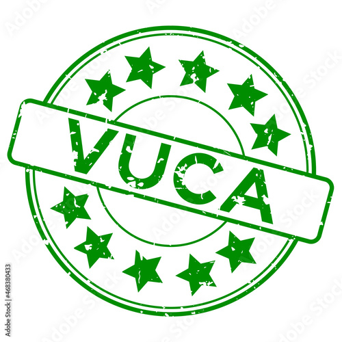 Grunge green vuca (abbreviation of Volatility, uncertainty, complexity and ambiguity) word with star icon round rubber seal stamp on white background