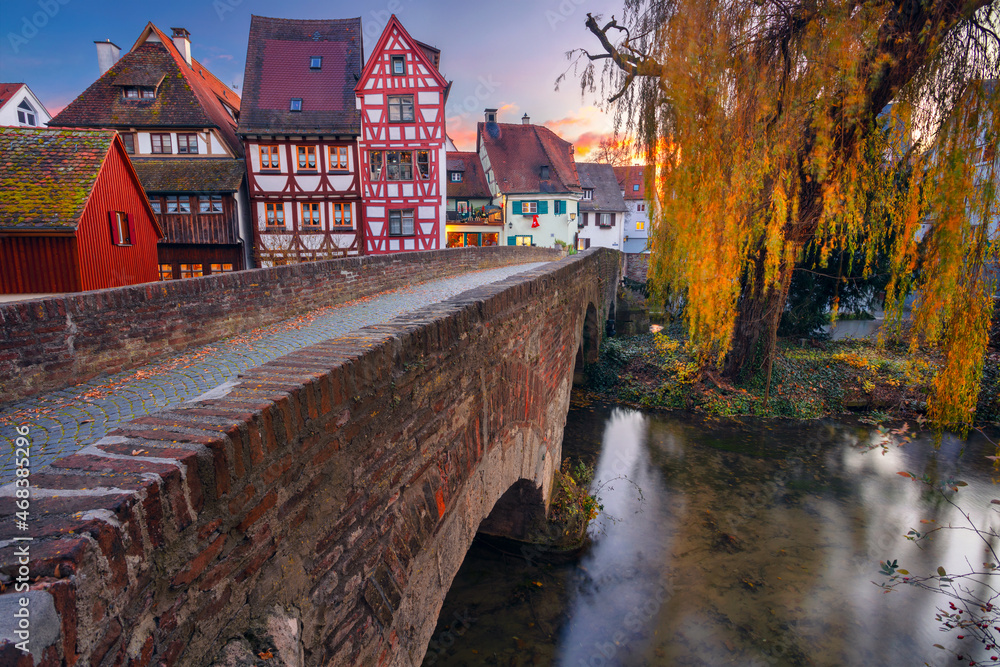 Ulm, Germany. Cityscape image of old town street of Ulm, Germany with traditional Bavarian architecture at autumn sunset.